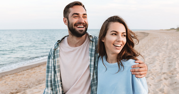A couple walking on a beach