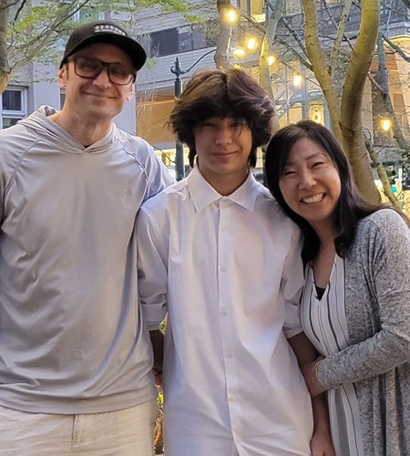 Chi is smiling with her family