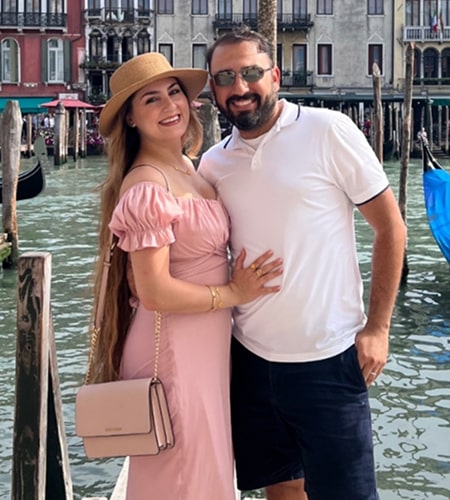 Dr. Noori is smiling with her family