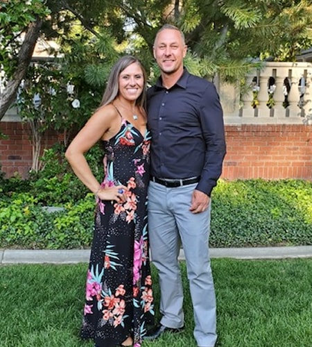 Katie is smiling with a man