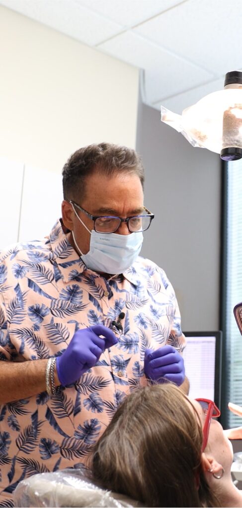 The Issaquah dentist and a smiling patient in a dental chair
