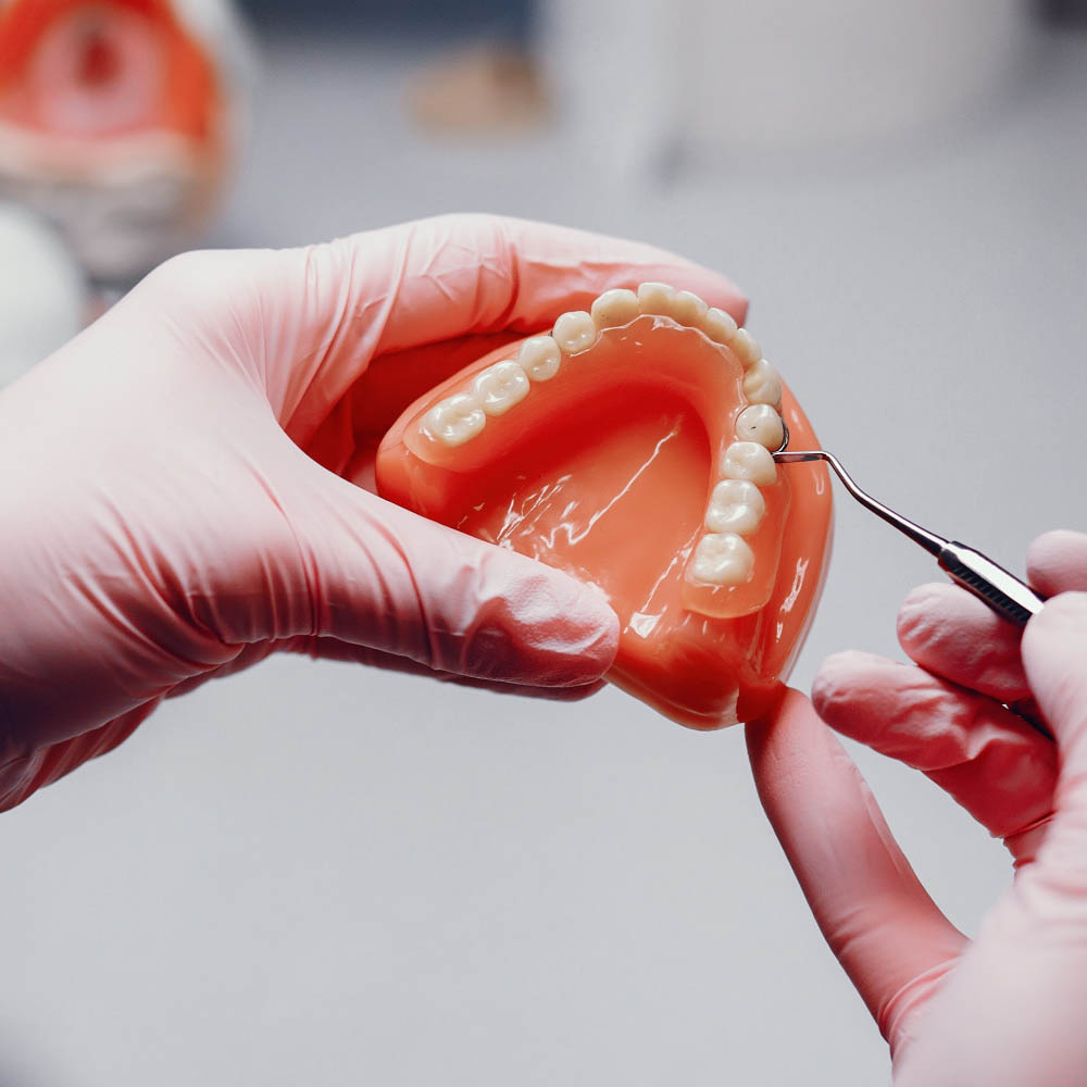 dentist working on dental bridges